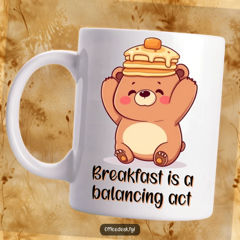 Funny mug featuring a clumsy bear struggling to balance a tall stack of pancakes perfectly on its head, looking goofy and adorable.