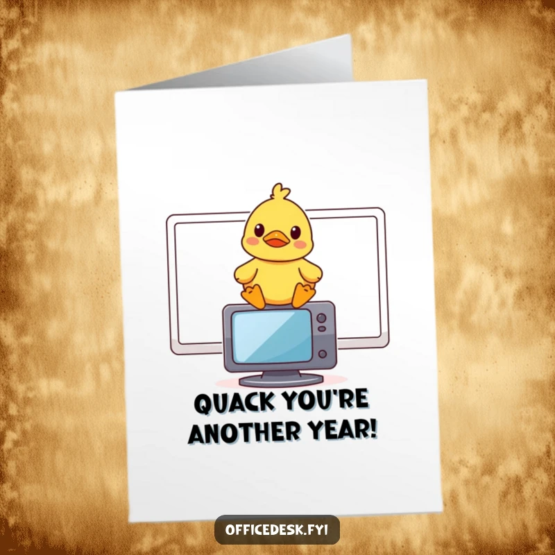 Funny Free Printable Birthday Card: A cheerful rubber duck perched atop a computer monitor, smirking with amusement.