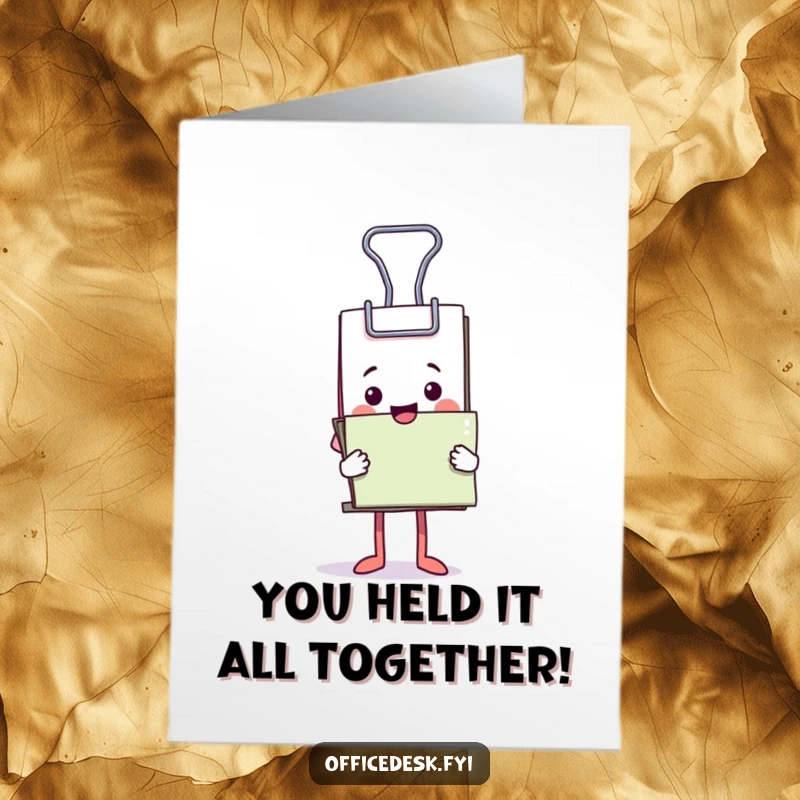 Funny Free Printable Congratulations Card: A cheerful binder clip mascot triumphantly holding an enormous pile of paperwork.