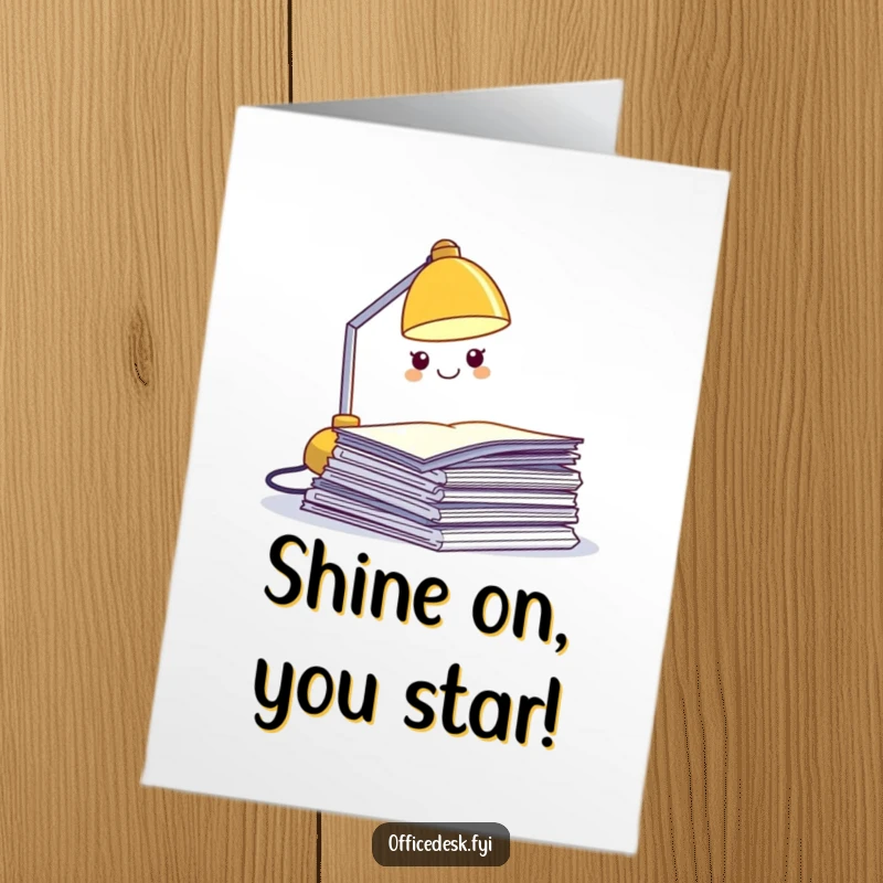 Funny Free Printable Congratulations Card: a smiling desk lamp character illuminating a stack of papers with pride.