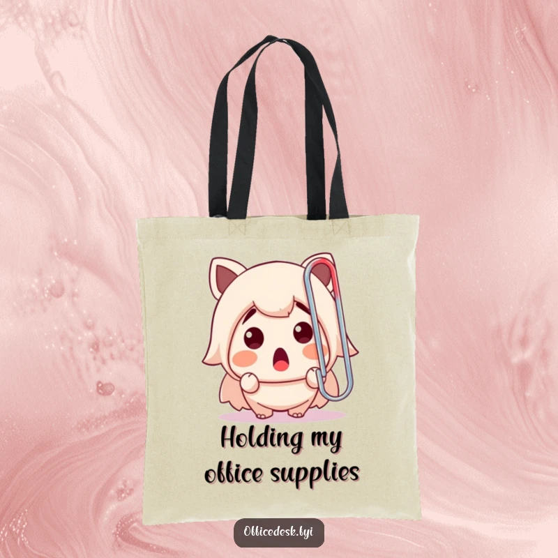 Funny tote bag depicting a cute character's shocked face staring at a colossal paperclip, a humorous office supply mishap.
